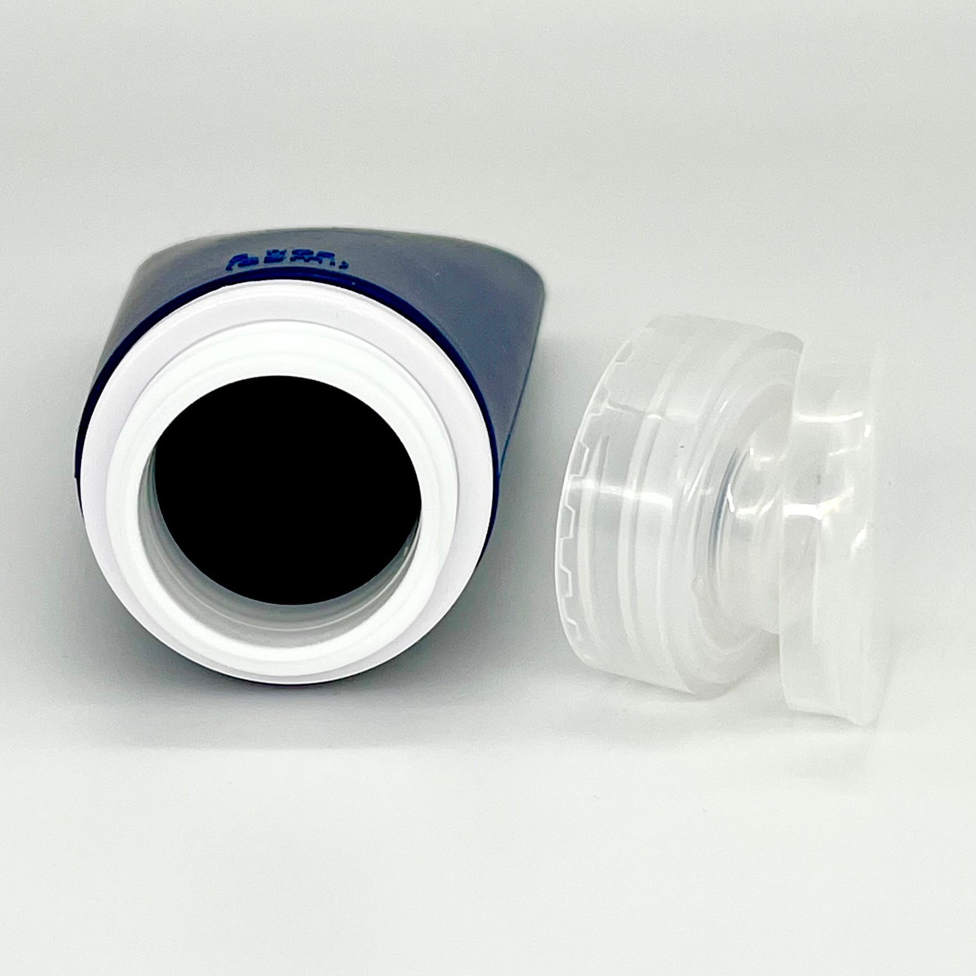 Pakabel blue silicone travel toiletry bottle with white rim and clear flip-top cap.