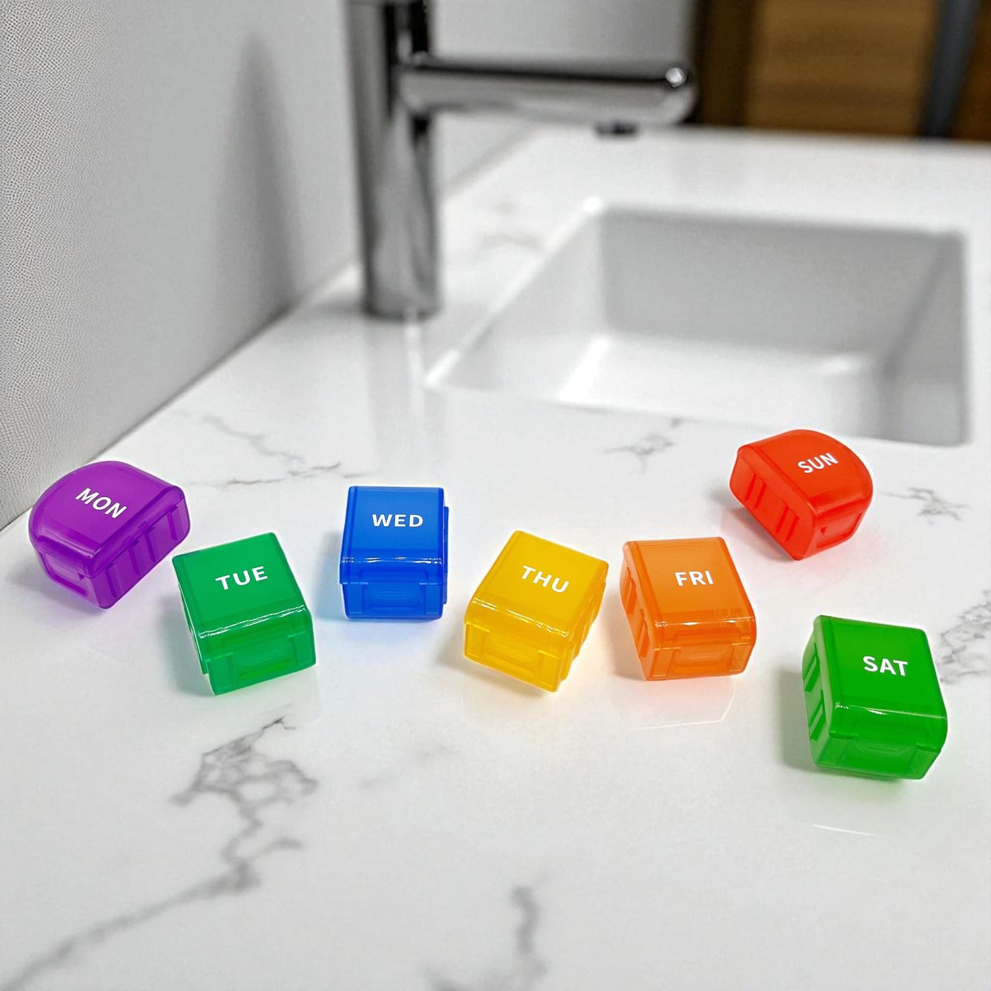 rainbow coloured pill box with seven days of the week that has been separated into individual day compartments
