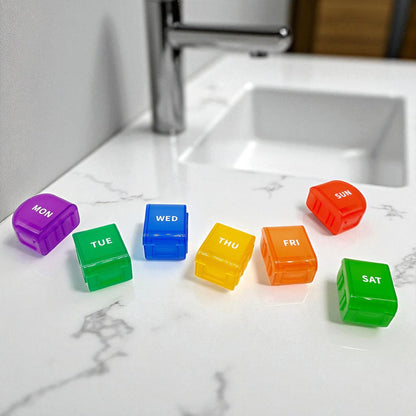 rainbow coloured pill box with seven days of the week that has been separated into individual day compartments